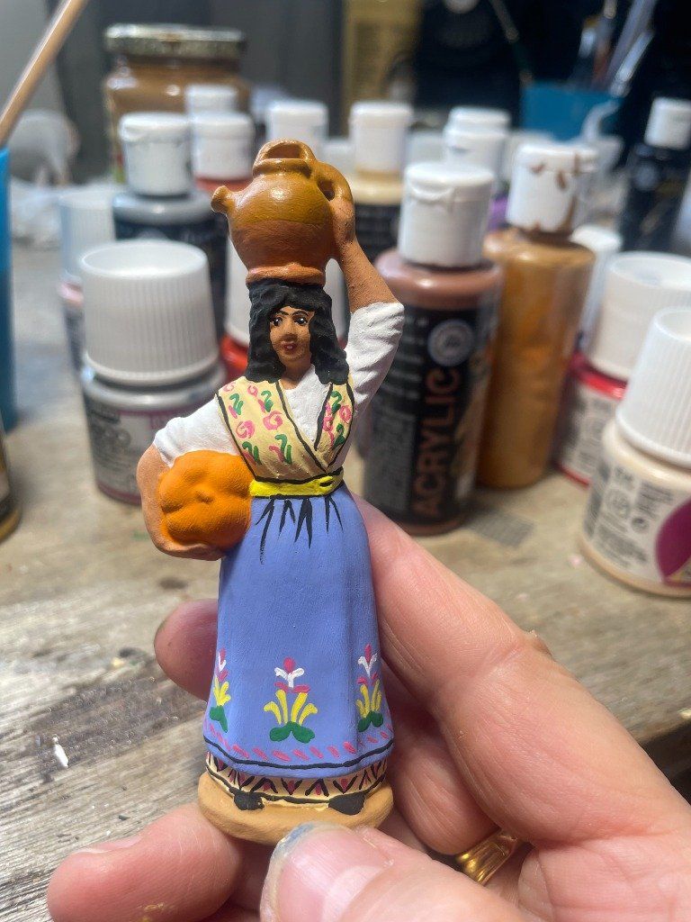 La porteuse de gargoulette et de courge